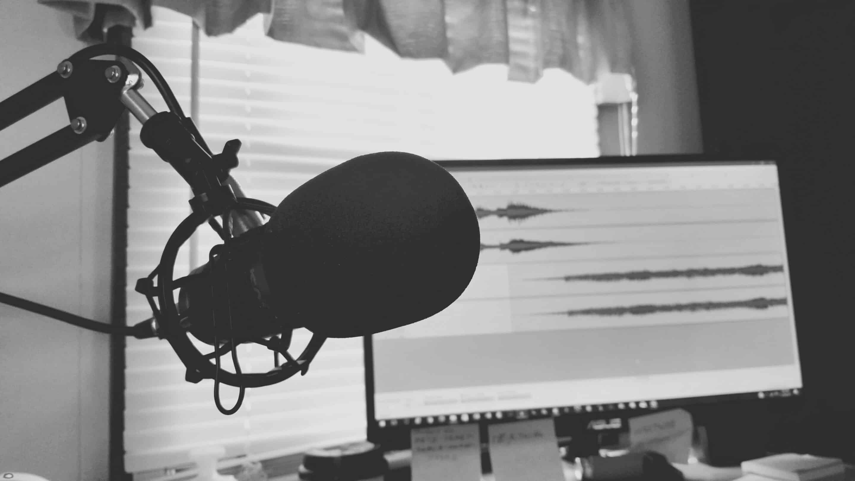 Greyscale photography of condenser microphone 765139 scaled listen