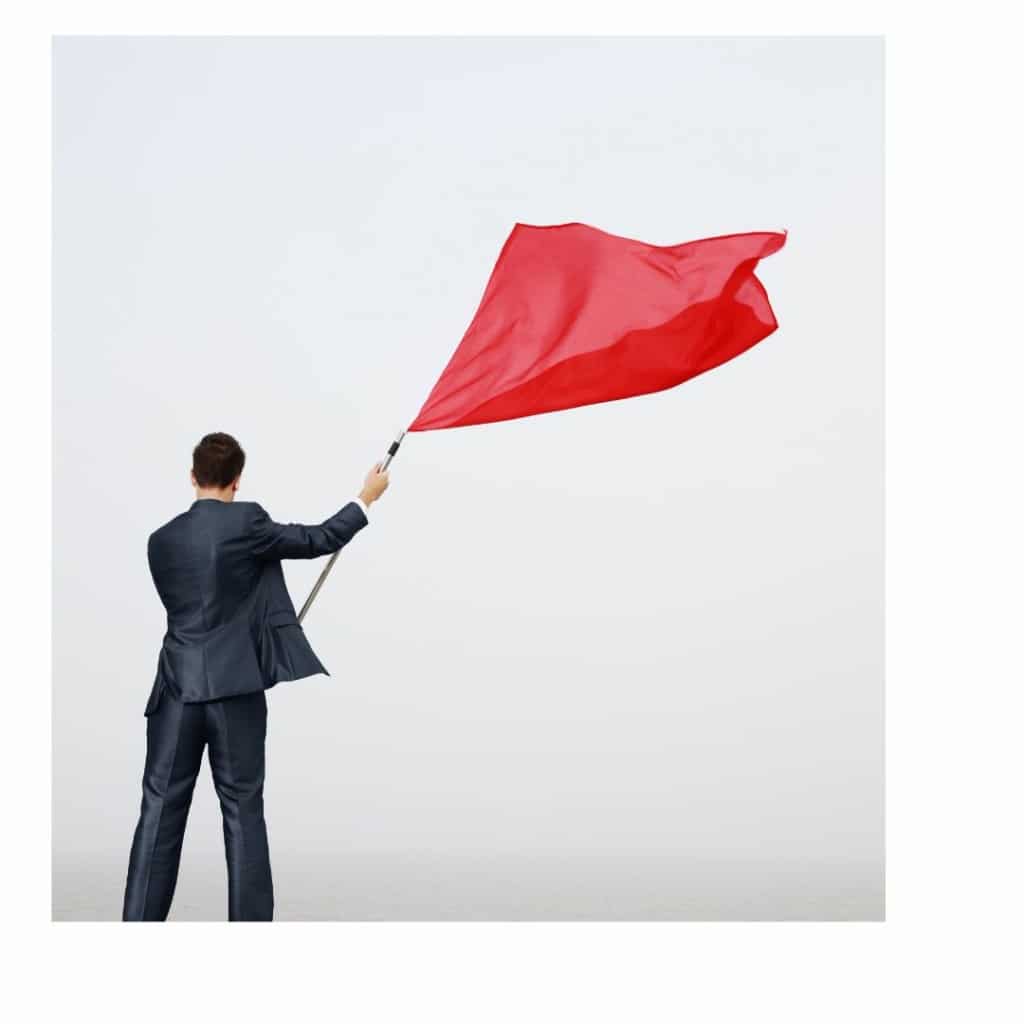 Man waving flag beware these interview red flags!